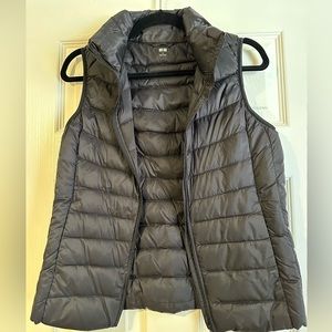 Uniqlo ultra lightweight packable down vest in black.